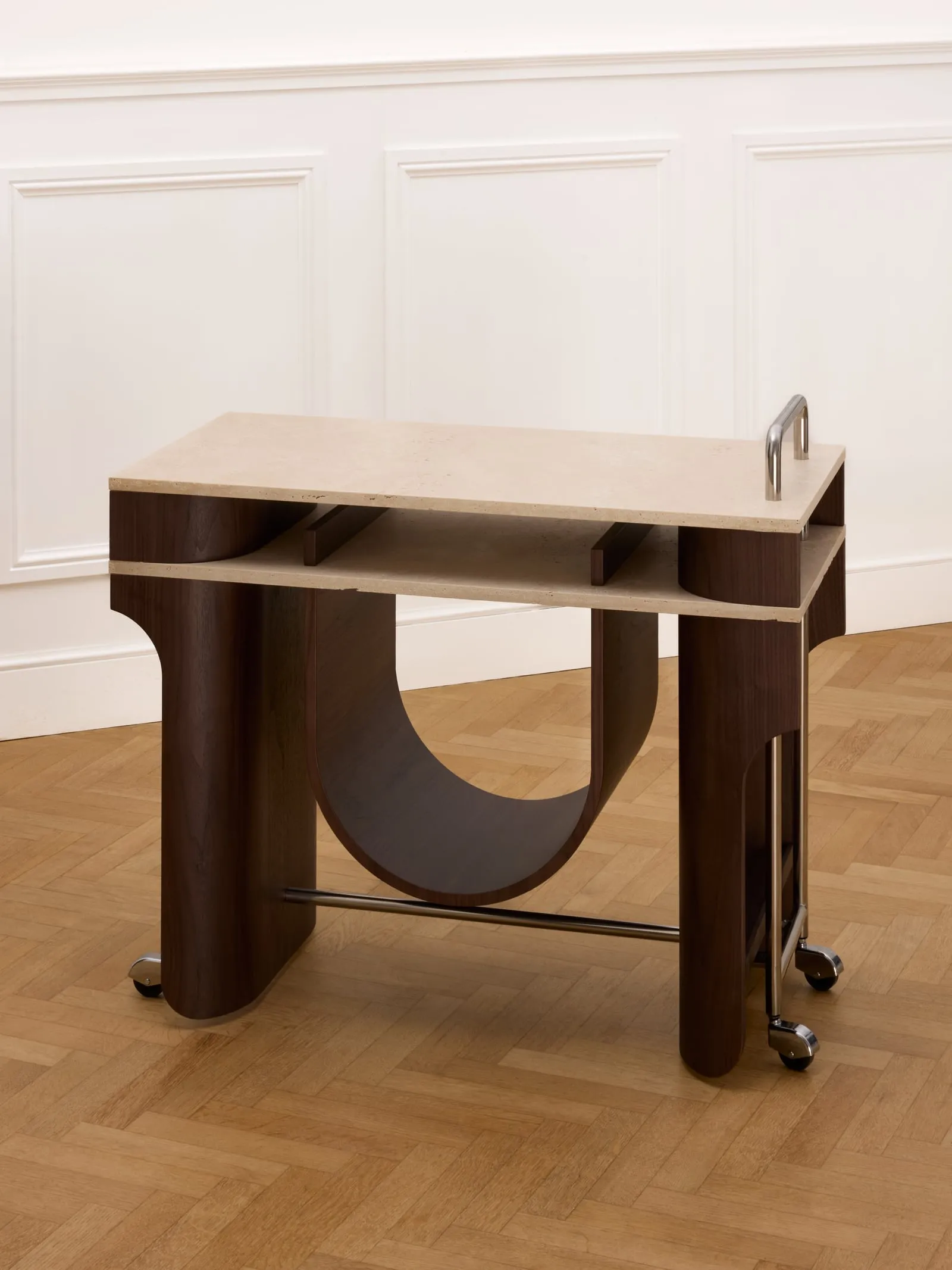 Arcus Bar Cart from a three-quarter angle in a white panelled room