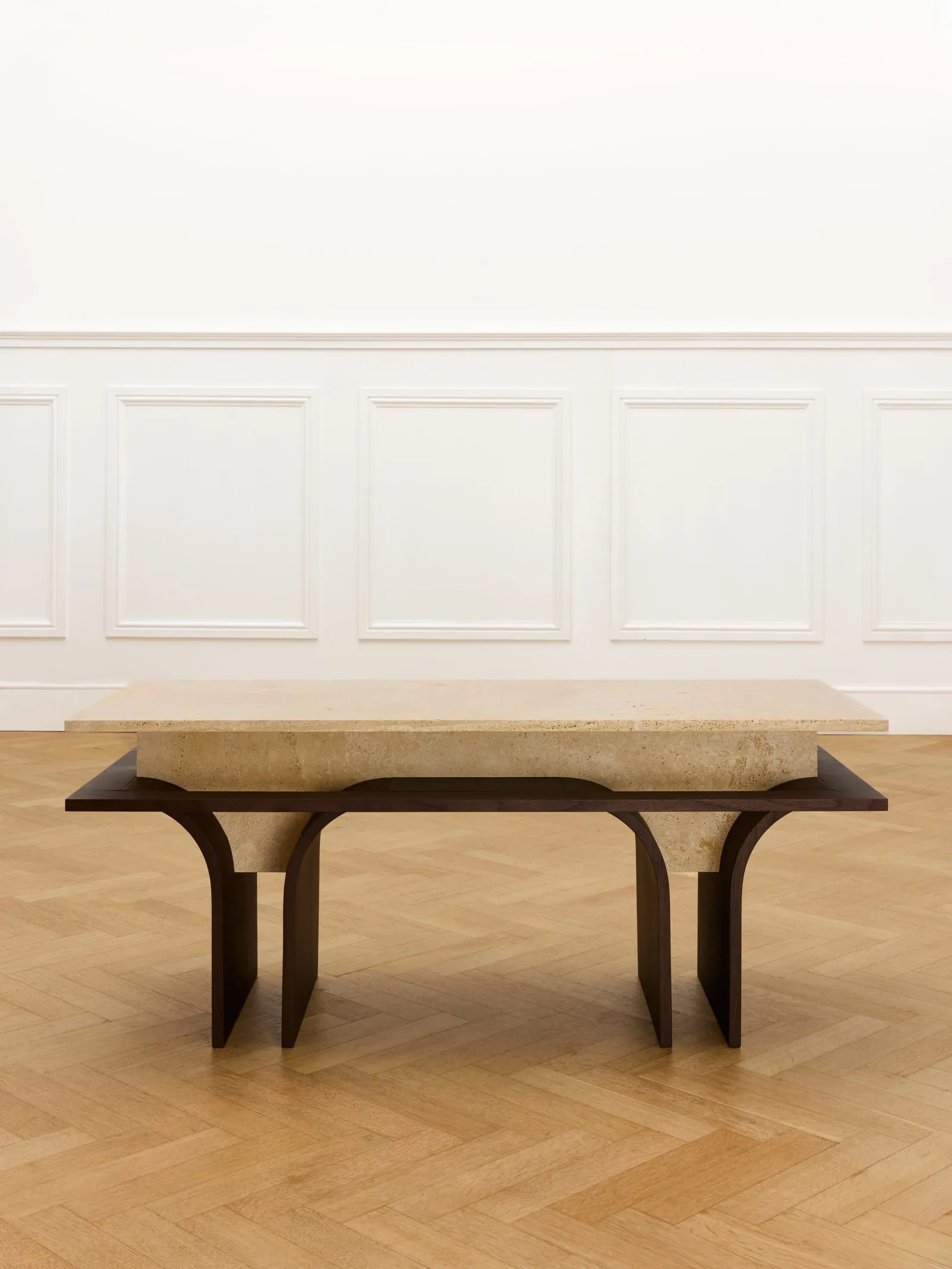 Arcus Bench from the front in a white panelled room with a parquet floor