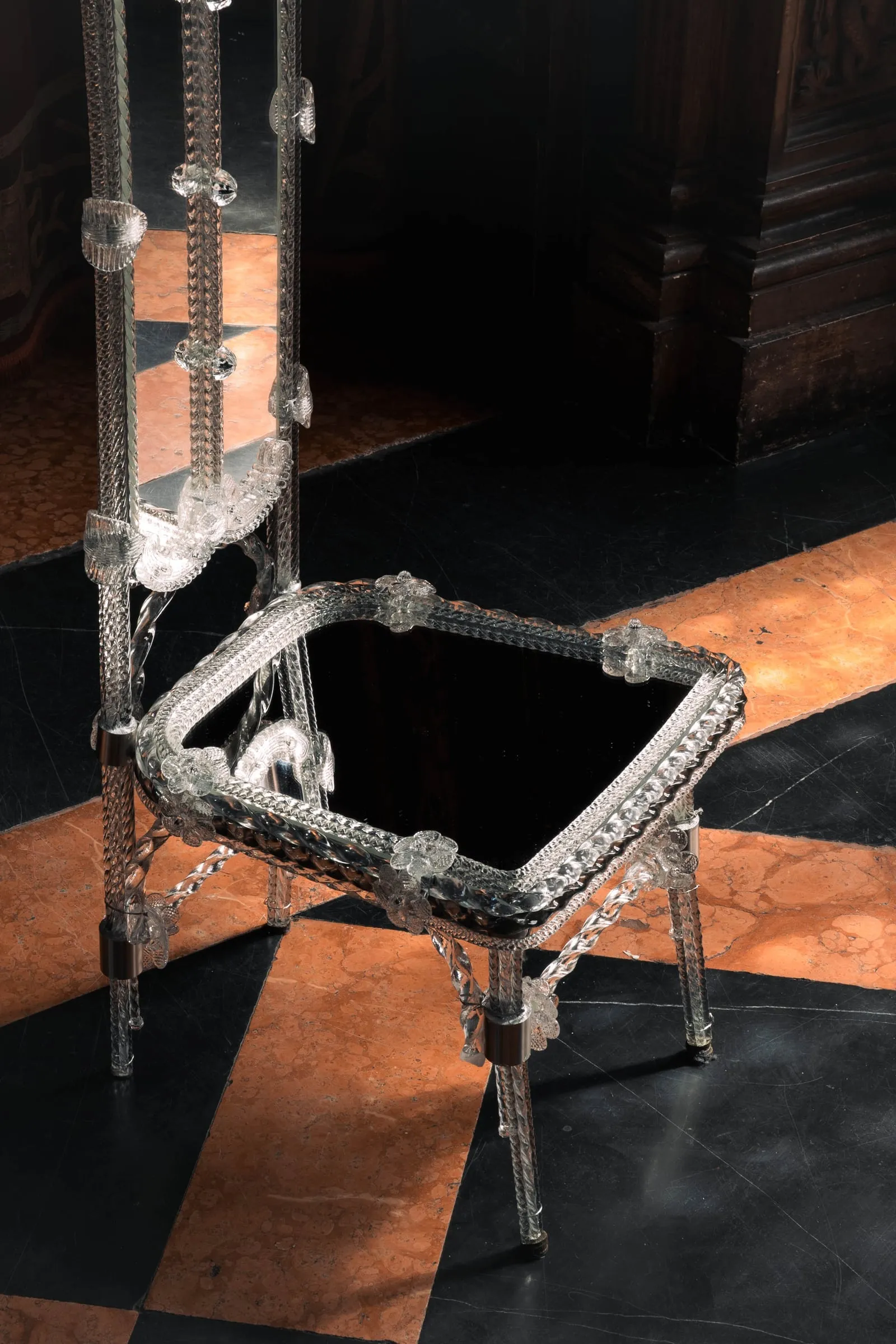 Detail of the Stemma Dining Chair: Murano glass frame and mirrored seat